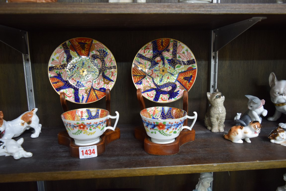 A pair of early 19th century English Imari porcelain teacups and saucers.