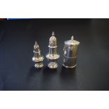 Three various silver pepperettes, 120g.