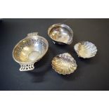 A pair of silver shell salts; together with a pierced silver bonbon dish; and a toddy ladle bowl.