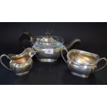 An Edwardian silver bachelor's three piece tea set, by John Round & Sons Ltd, Sheffield 1909/1910,