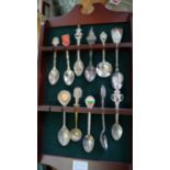 A quantity of plated souvenir spoons and similar.