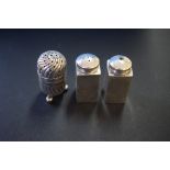 A pair of .925 silver pepperettes; and another silver pepperette, 60g.