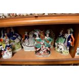 Six Victorian Staffordshire pottery Highland figure groups.