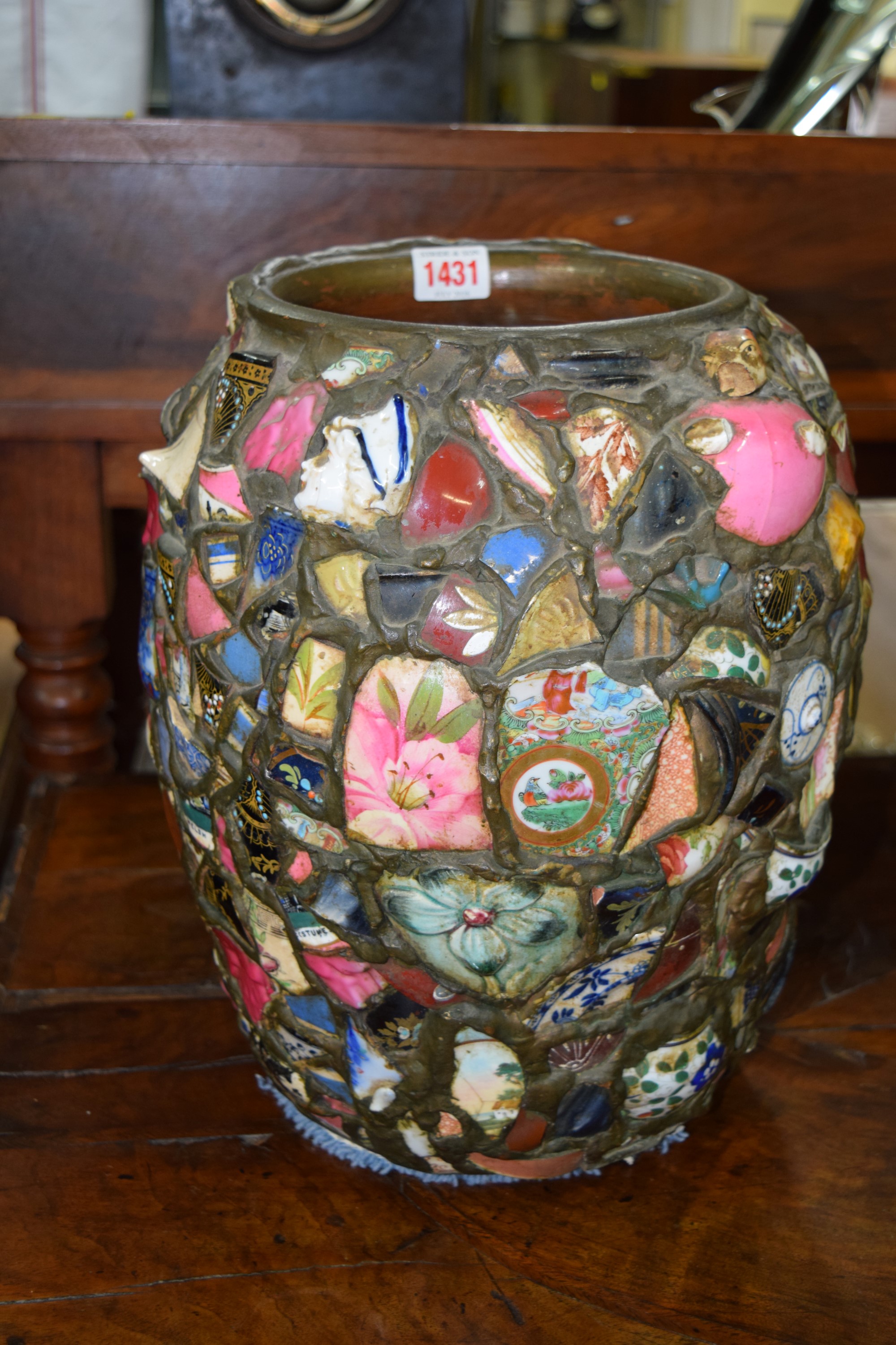 An old 'chipware' vase, comprising 19th century pottery and porcelain, 33cm high.