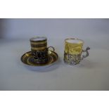 A silver mounted Limoge coffee can and saucer, by Army and Navy Cooperative Society Ltd,