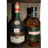 A 1 litre bottle of St Remy Napoleon brandy; together with a 70cl bottle of Drambuie.