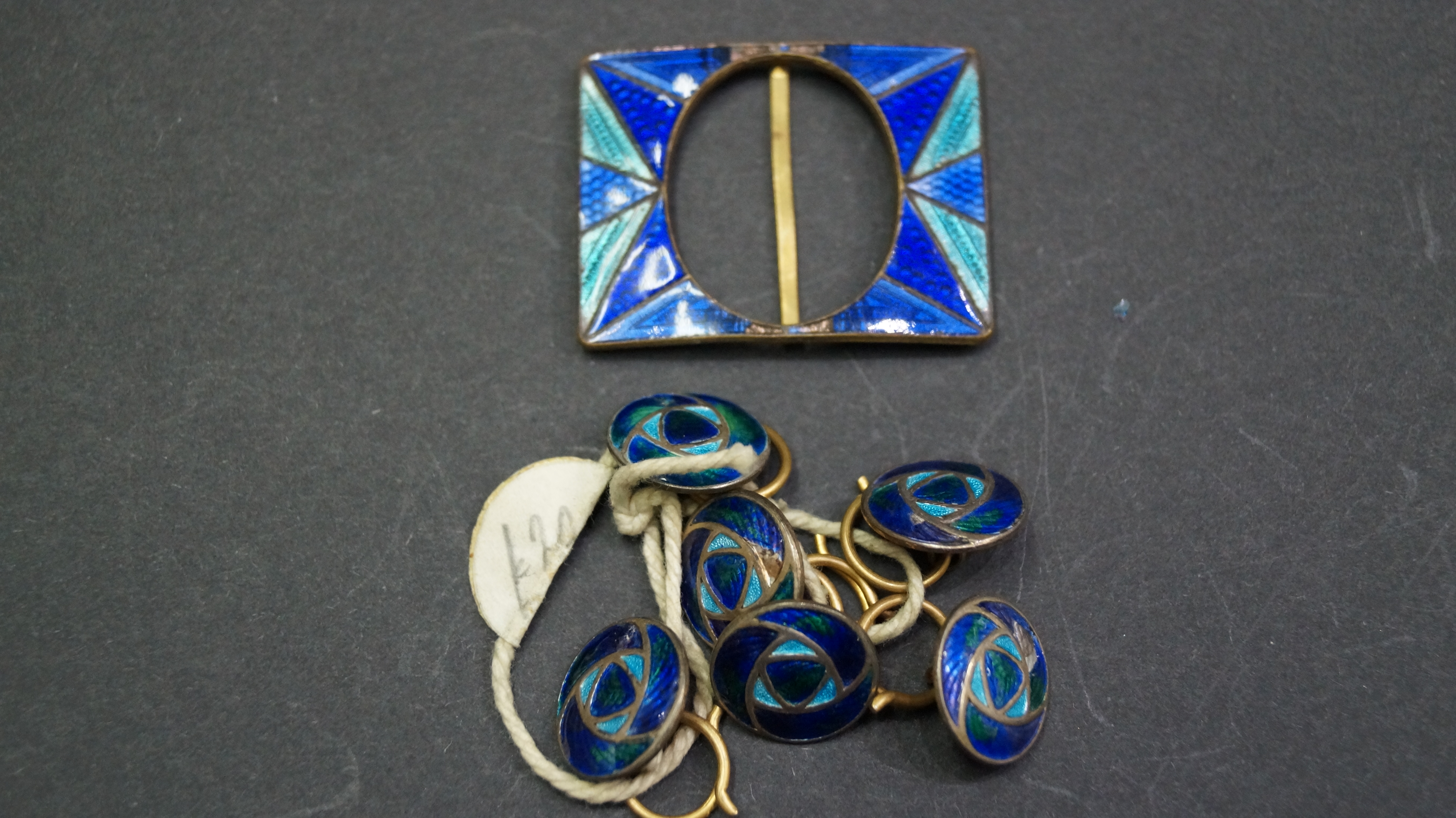 A blue and turquoise enamel buckle,