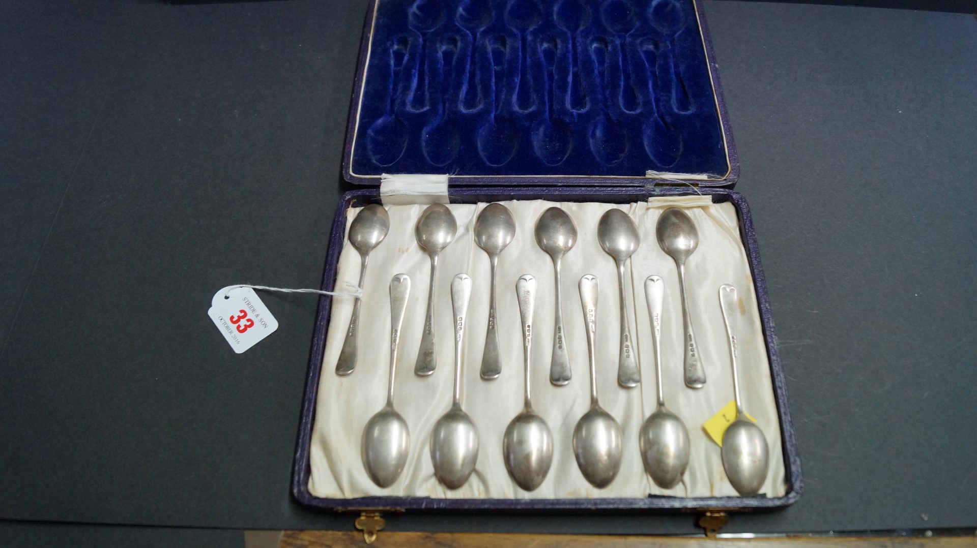 A cased set of twelve silver Hanoverian pattern teaspoons, by Henry Williamson Ltd, Birmingham 1921,