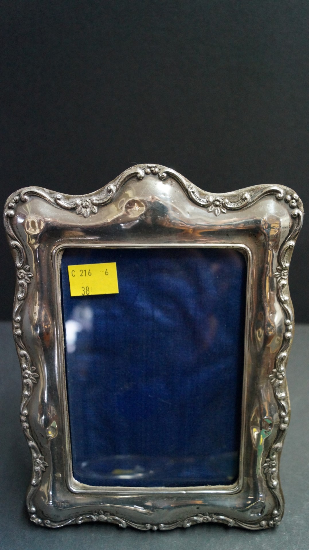 Two silver rectangular photograph frames and two silver oval eamples.