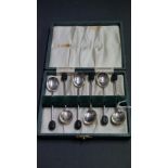 A cased set of six silver coffee spoons with bean handles, by Cooper Brothers & Sons,