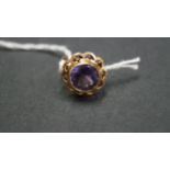 A 14k synthetic alexandrite ring.