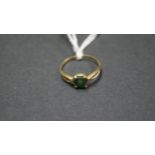 An 18ct gold ring set emerald.