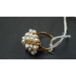 An unmarked cocktail ring set baroque pearls.