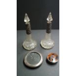 A pair of silver mounted conical cut glass scent bottles, by William Devenport, Birmingham 1911,