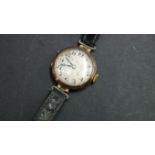 A vintage 9ct gold ladies wristwatch, having leather strap.