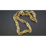 A modern unmarked silver entwined heart bracelet; and a modern silver gilt necklace, by R S.