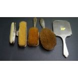Five various silver dressing items,