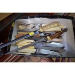 A quantity of bone handled knives and other cutlery.