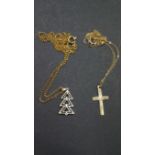 A 9ct gold cross on fine gold necklace and another pendant on plated necklace.