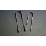 A pair of Georgian bright cut silver sugar tongs,