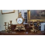 A good late 19th century, Louis XV style, ormolu clock garniture, the clock 34.5cm high.