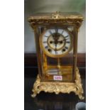 A late 19th century gilt metal four glass mantel clock, with mercury pendulum, 30.5cm high.