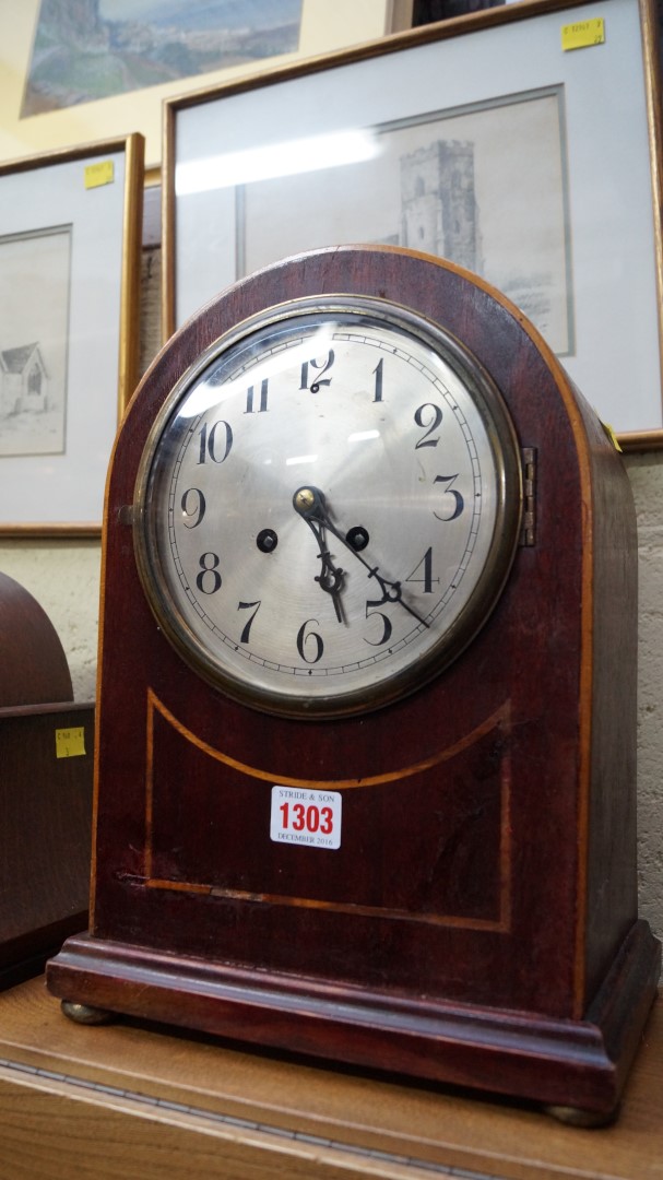 Three various mantel clocks.