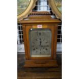 A late 19th century oak musical mantel clock, striking on five gongs, 45.5cm high.