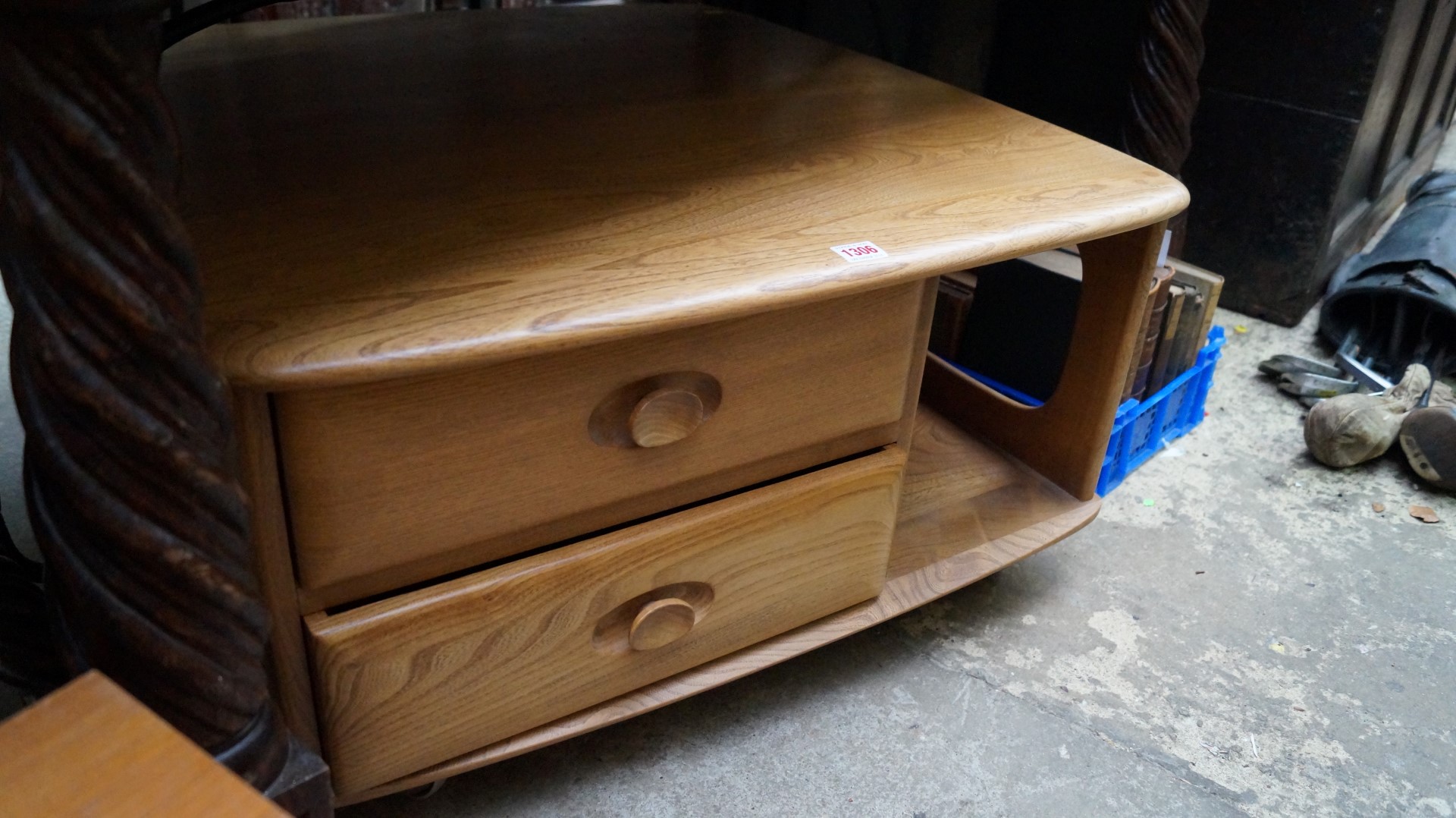 An Ercol elm low coffee table, incorporating two drawers, 79.5cm wide.