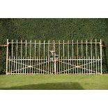 A pair of wrought and cast iron estate gates early Victorian 122cm.; 48ins high by 304cm.; 120ins