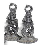 A pair of cast iron doorstops mid 19th century cast in the form of cherubs amongst foliage 37cm.;