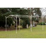 A wrought iron haut vent arbour French, mid 20th century 5m.; 16ft 5in long by 3m.; 9ft 10in wide