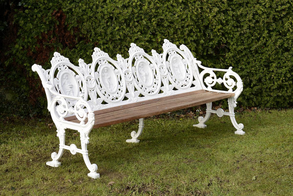 Garden Seat: A rare pair of Macauley and Wade four seasons pattern cast iron seats last quarter 19th