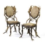 Furniture: A pair of Antler hide and oak chairs probably Continental, early 20th century112cm.;