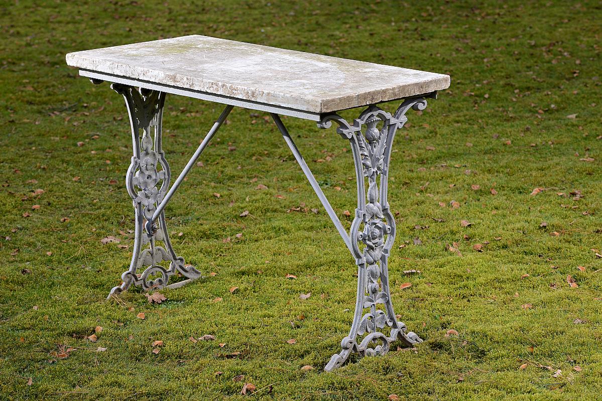 Garden Table: A Victorian cast iron table with marble top circa 1880 96cm.; 38ins long