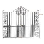 A pair of wrought iron gates early 20th century 276cm.; 116ins wide overall