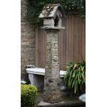 An unusual carved limestone bird table early 20th century 193cm.; 76ins high