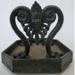 A late Regency cast iron boot scraper English, circa 1840 supported on lion paw scroll feet,