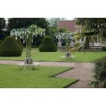 Garden Seat: A similar wrought iron strapwork circular seat with treillage canopy