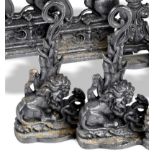 A pair of Kenrick foundry cast iron doorstops mid 19th century each cast with a lion and serpent