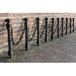 A set of ten cast iron bollards with chain early 20th century with makers stamp W A Baker & Co.,