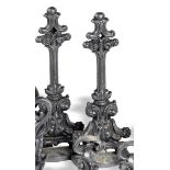 A pair of cast iron doorstops mid 19th century cast with scroll decoration 43cm.; 17ins high