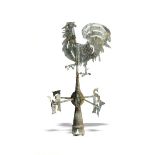 A sheet copper weathervane in the form of a Cockerel mid 19th century 122cm.; 48ins high, together