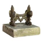 A substantial Gothic style cast iron bootscraper mid 19th century on later composition stone base