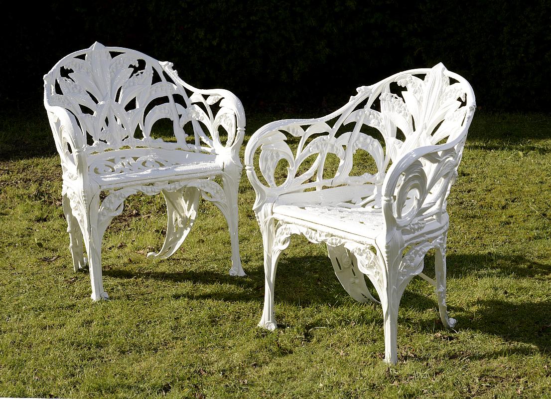 Garden Seat: A pair of rare Coalbrookdale Lily of the Valley pattern cast iron chairs circa