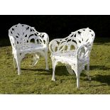 Garden Seat: A pair of rare Coalbrookdale Lily of the Valley pattern cast iron chairs circa