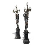 Garden Statue: A pair of Durenne foundry cast iron Egyptian figural torchères on pedestals French,