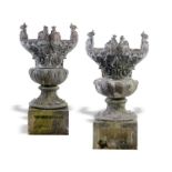 Garden Urns: A pair of rare lead urnscirca 1900on later composition stone pedestals124cm.; 49ins