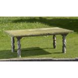 Garden Tables: A wrought iron table with monumental York stone top196cm.; 77ins by 132cm.; 52ins