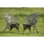 Garden Seats: A pair of Coalbrookdale Fern and Blackberry pattern cast iron seats en-suite to the